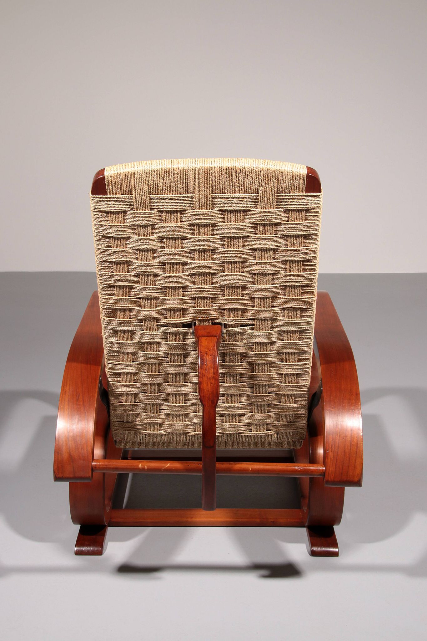 An exceptionally rare mahogany recliner crafted in Italy during the 1950s"