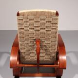 An exceptionally rare mahogany recliner crafted in Italy during the 1950s"