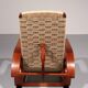 An exceptionally rare mahogany recliner crafted in Italy during the 1950s"