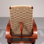 An exceptionally rare mahogany recliner crafted in Italy during the 1950s"