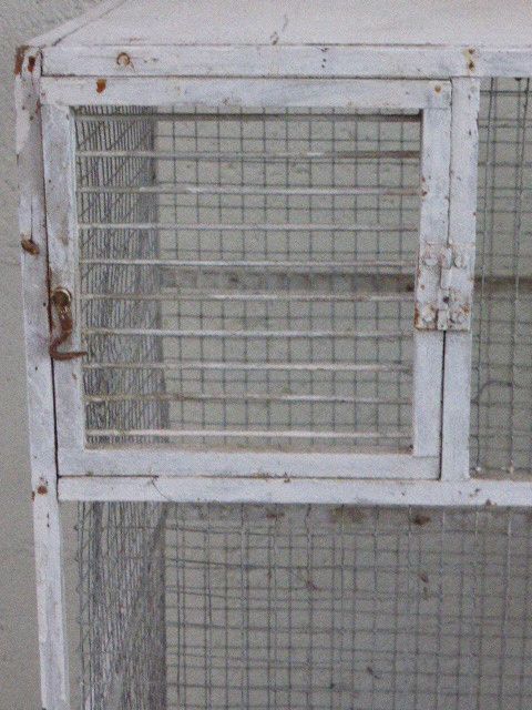 Vintage bird cage, made of wood and chicken wire metal square mesh