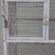 Vintage bird cage, made of wood and chicken wire metal square mesh