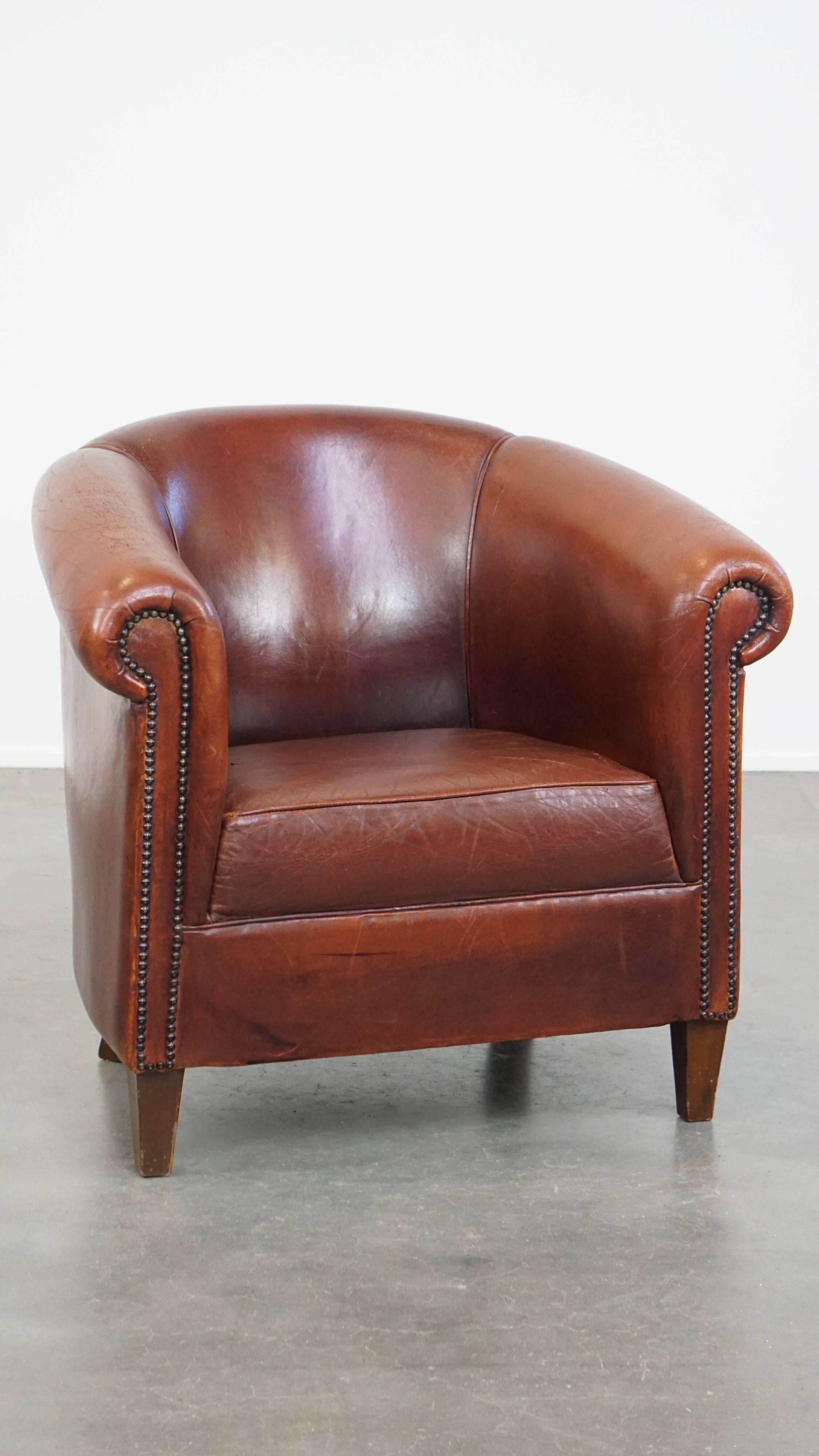 English style sheepskin club chair with a beautiful patina