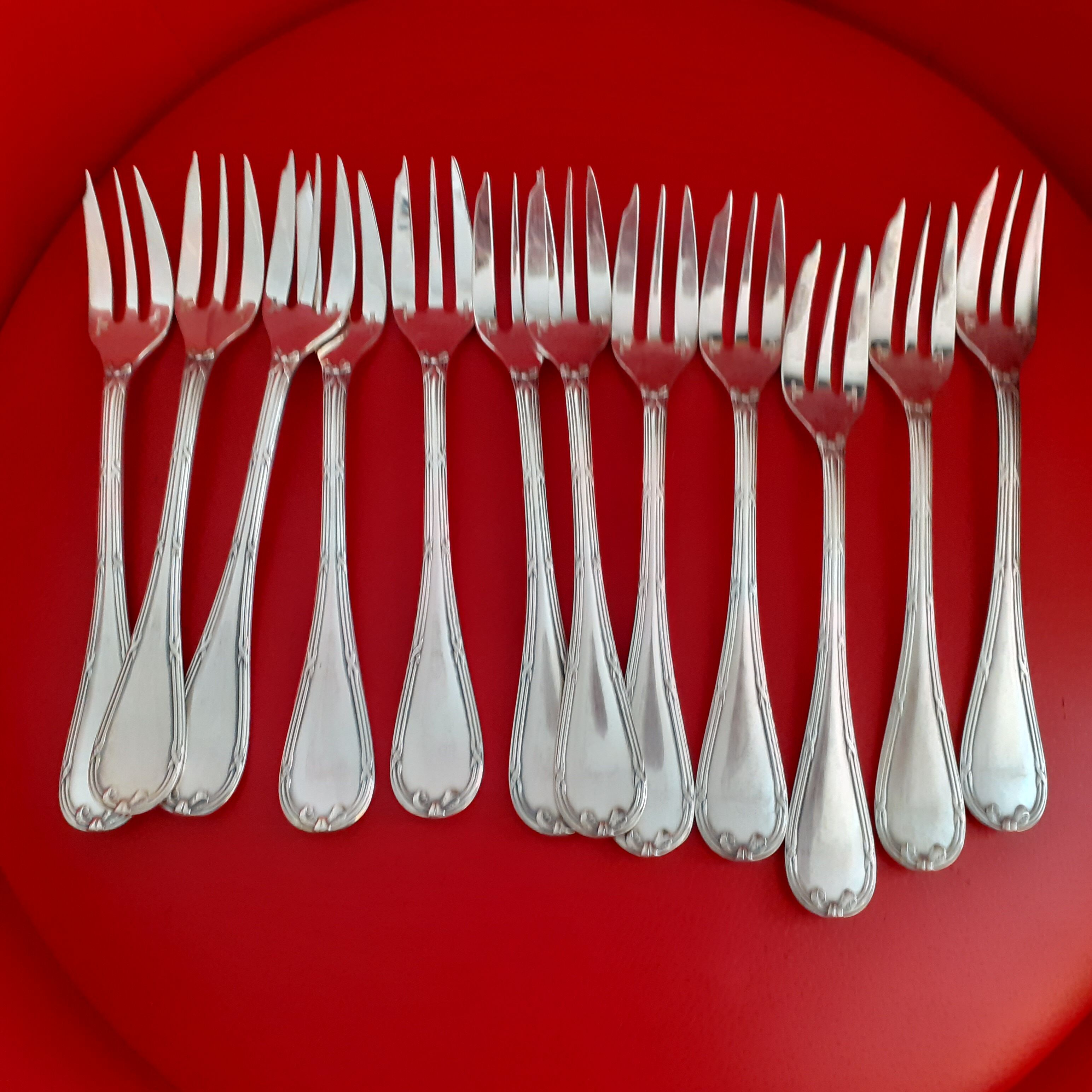 12 Christofle cake spoons. Ribbon template.