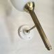 Pair of brass torch wall lights with white opal glass and porcelain