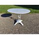 Garden table with a cast iron base and a metal top.