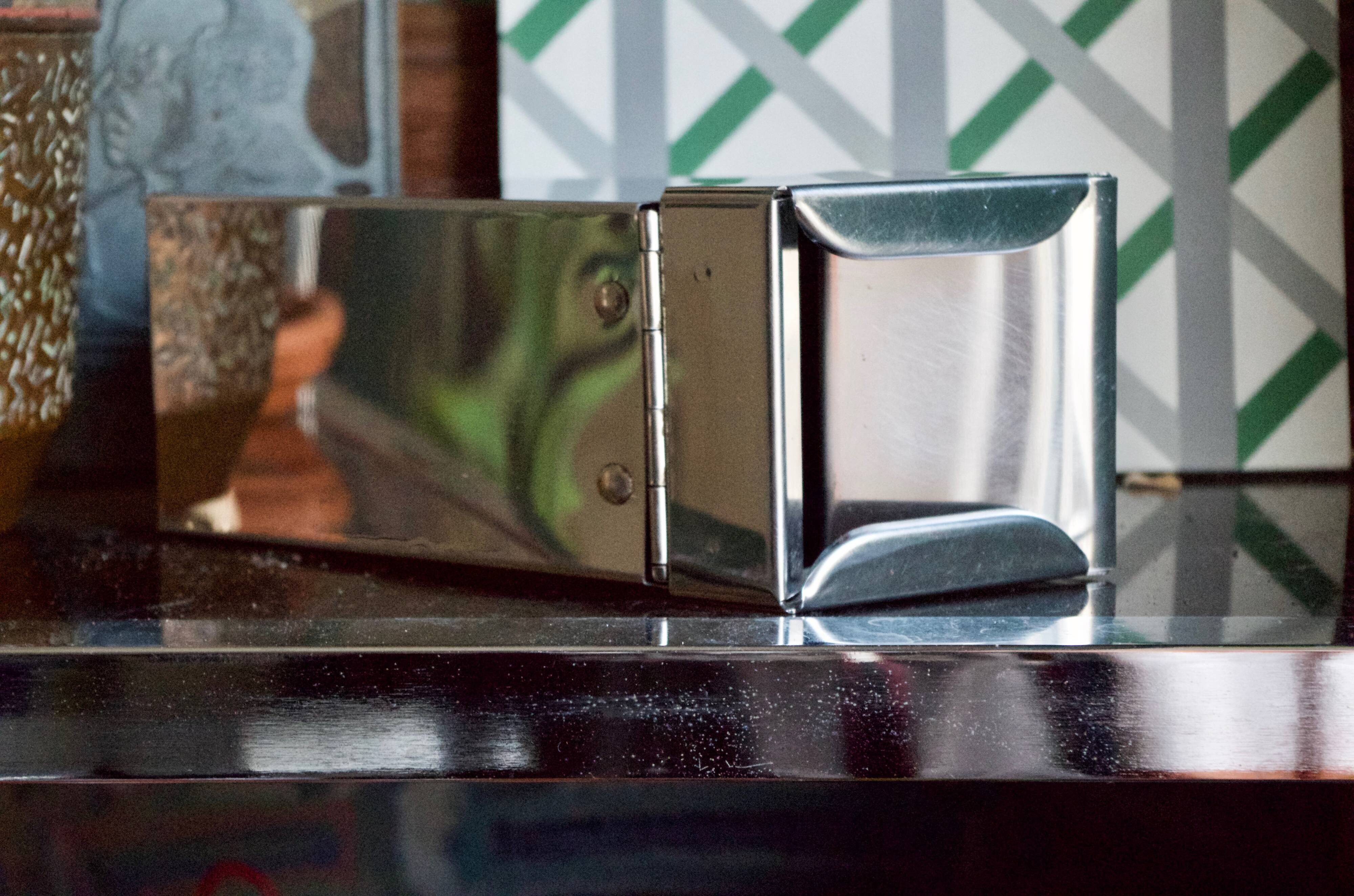 Vintage wall ashtray in shiny metal industrial style