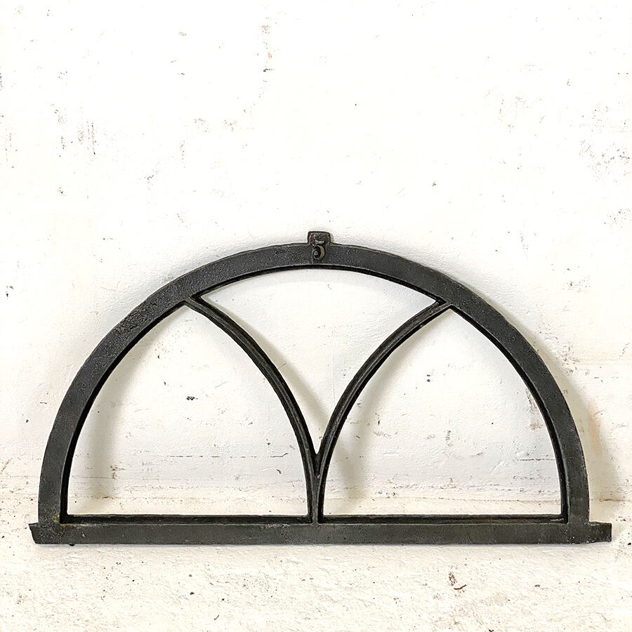 Old arched anthracite grey window