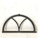 Old arched anthracite grey window
