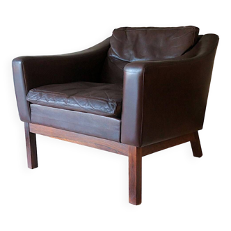 Danish rosewood and patinated leather lounge chair with down-filled cushions by Poul M Jessen, 1960s