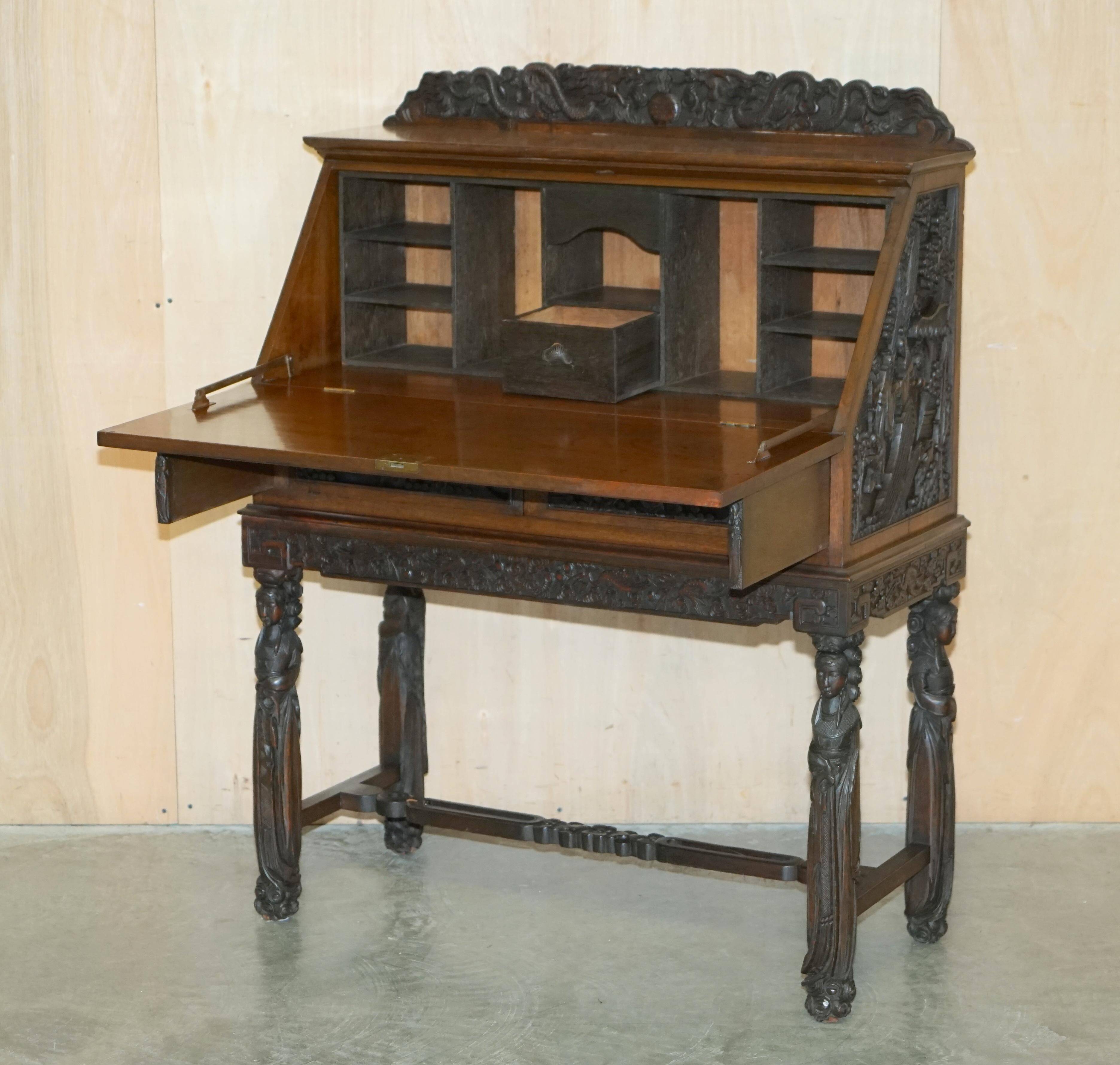 Chinese hand-carved desk from around 1940 with matching chair.