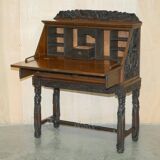 Chinese hand-carved desk from around 1940 with matching chair.