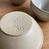 Trio of beige enamelled sandstone bowls