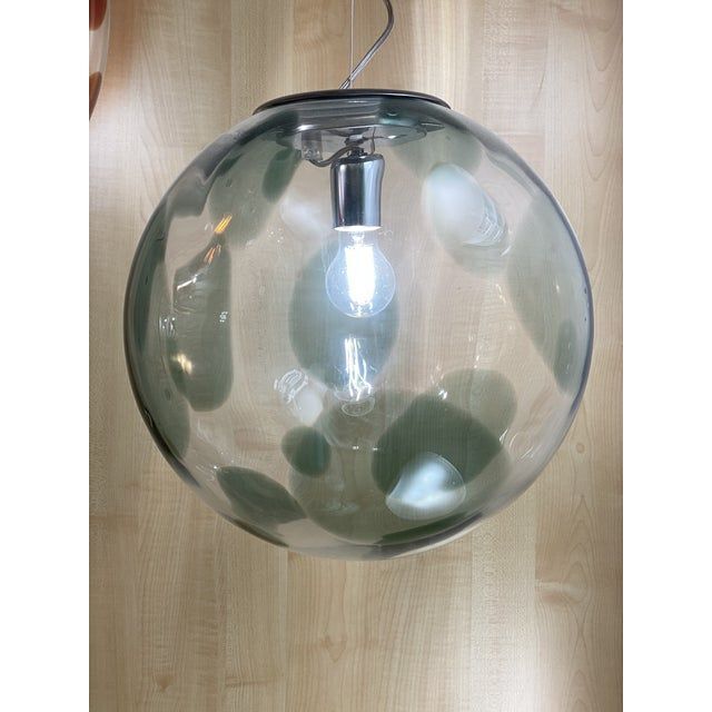 1990s contemporary olive-green and transparent sphere in murano glass