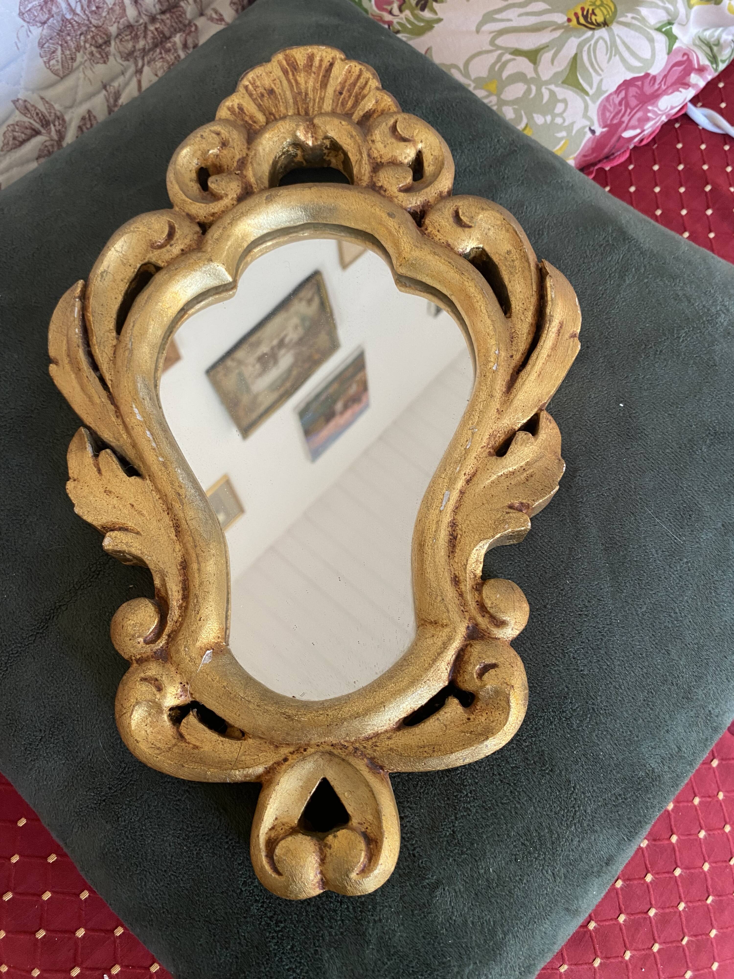 Golden mirror in baroque style.