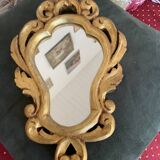 Golden mirror in baroque style.