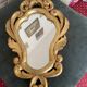 Golden mirror in baroque style.