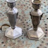 Pair of metal candlesticks, chiseled with a statuette in front, rose pattern in relief, art deco