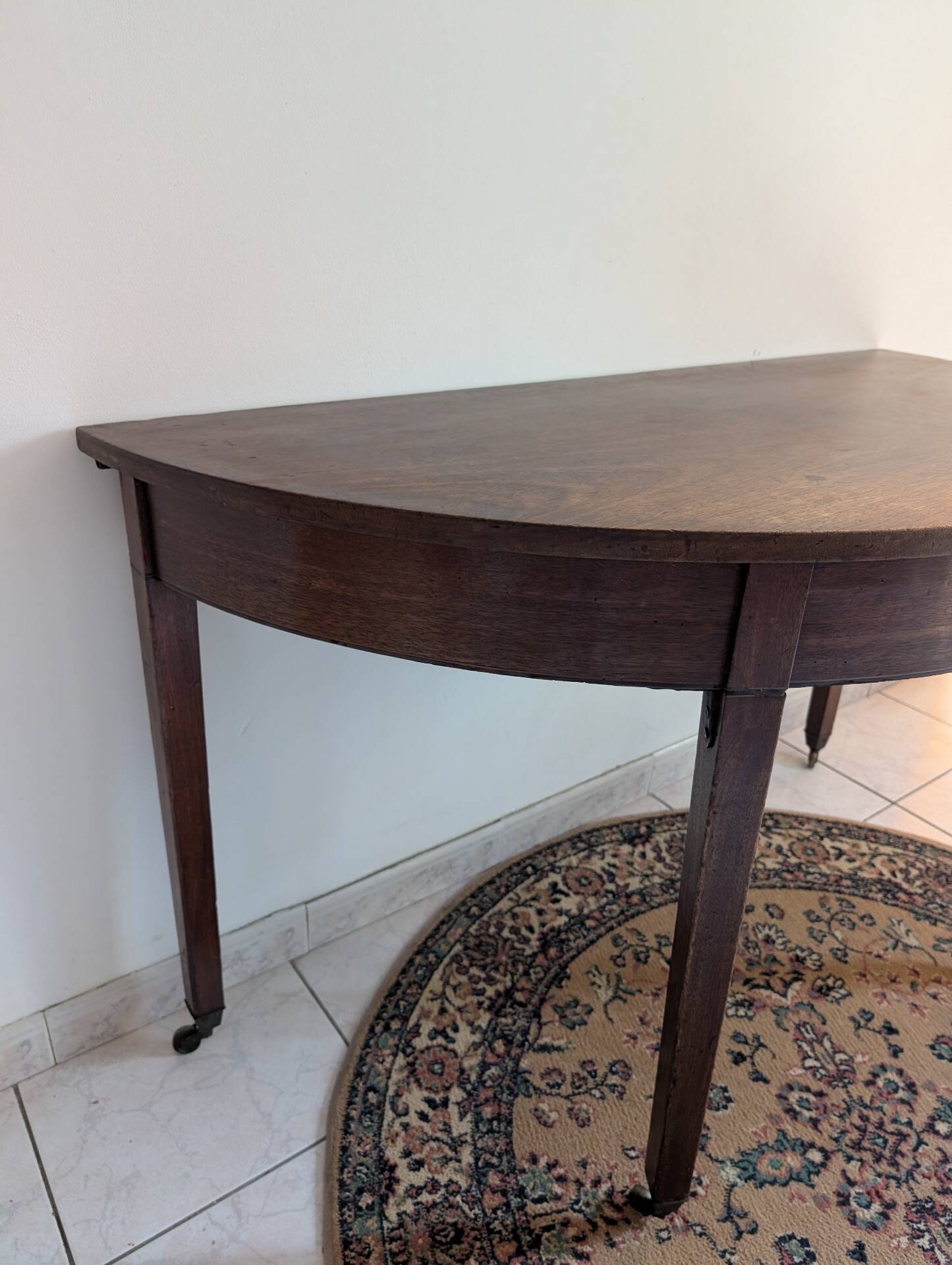 Old half-moon table or serving trolley on wheels