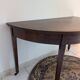 Old half-moon table or serving trolley on wheels