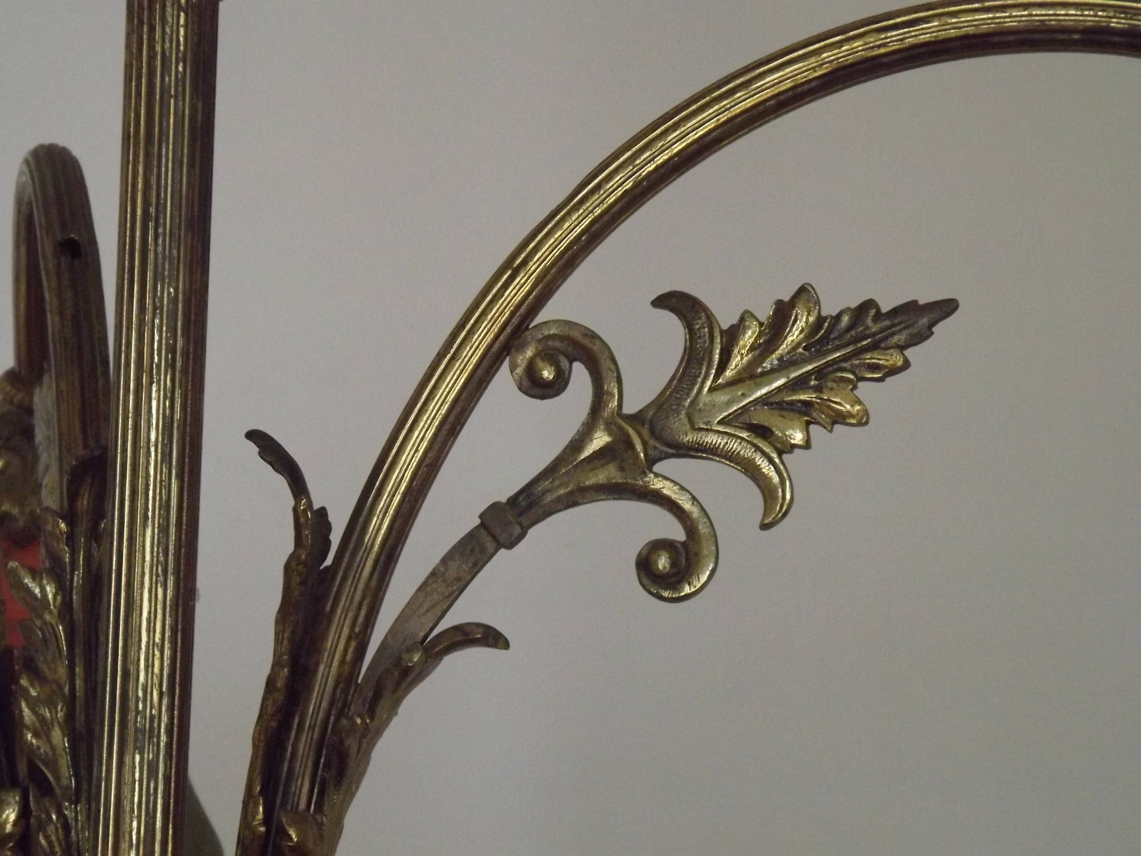 Art Nouveau three-light chandelier in bronze with orange and green glass shade, France.