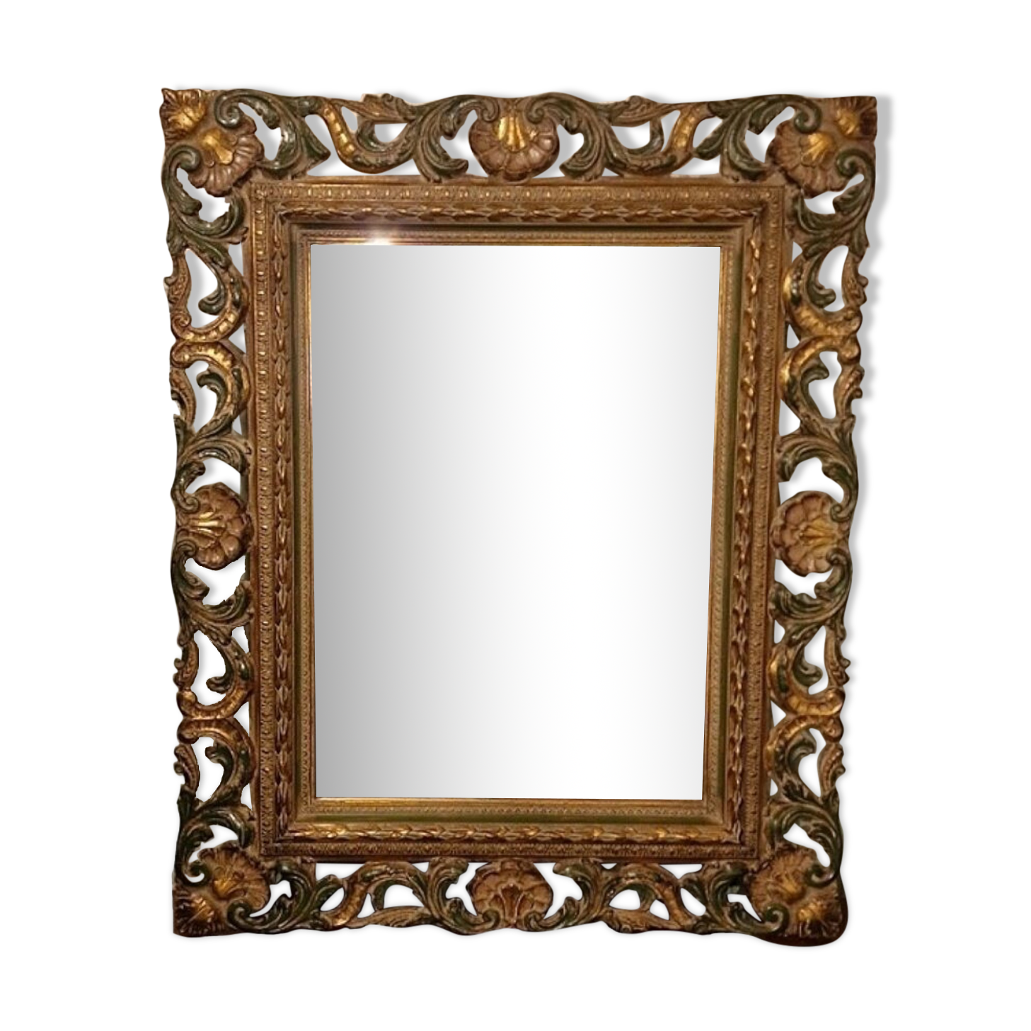 Bevelled mirror and carved wood