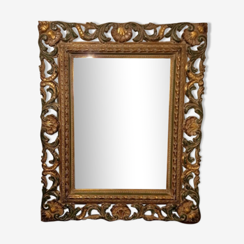 Bevelled mirror and carved wood