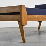 Wooden bench with midnight blue fabric, France, circa 1955