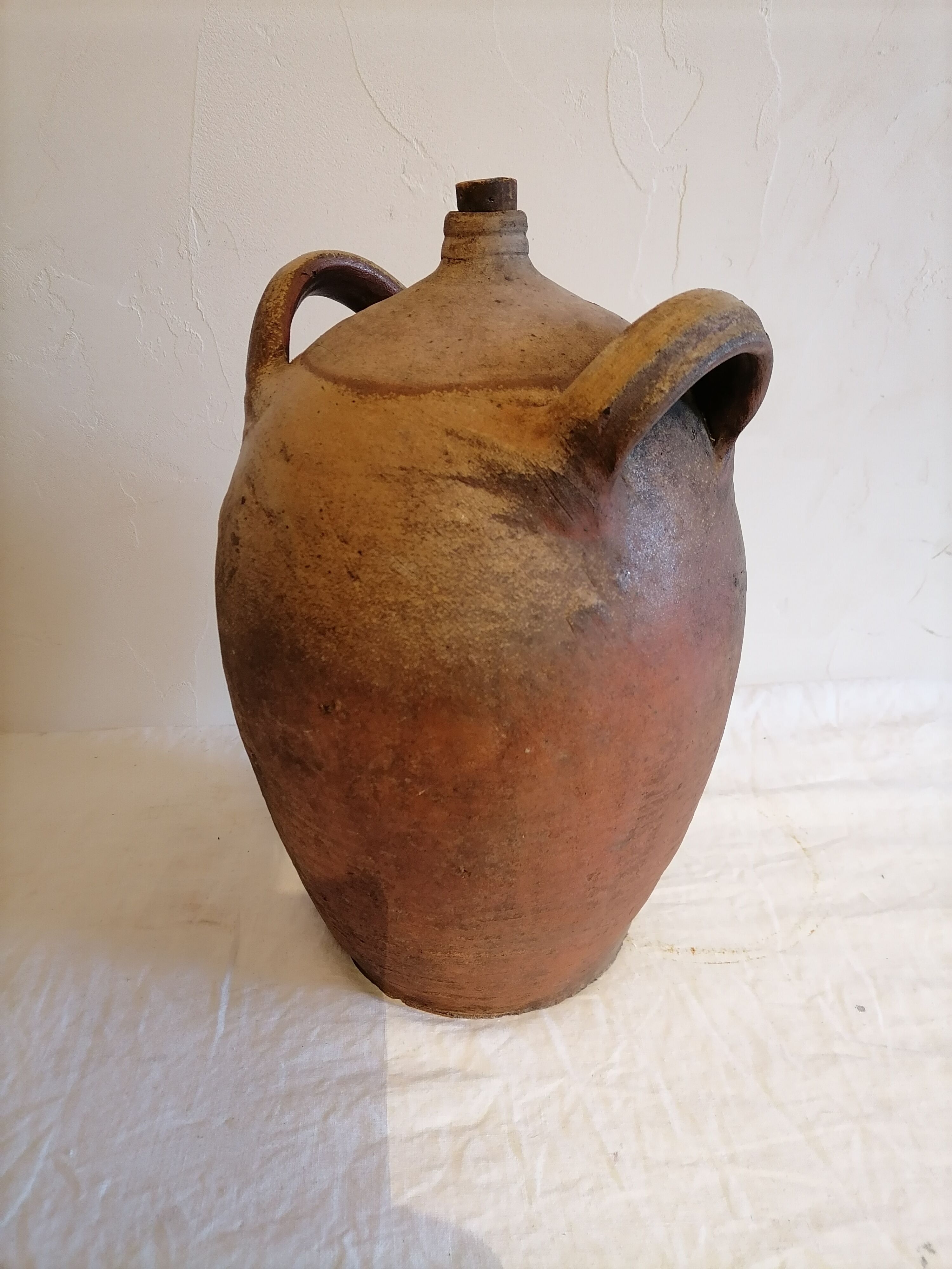 Old jar, glazed sandstone jug. Early twentieth century.