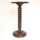 Wooden pedestal table with spiked columns