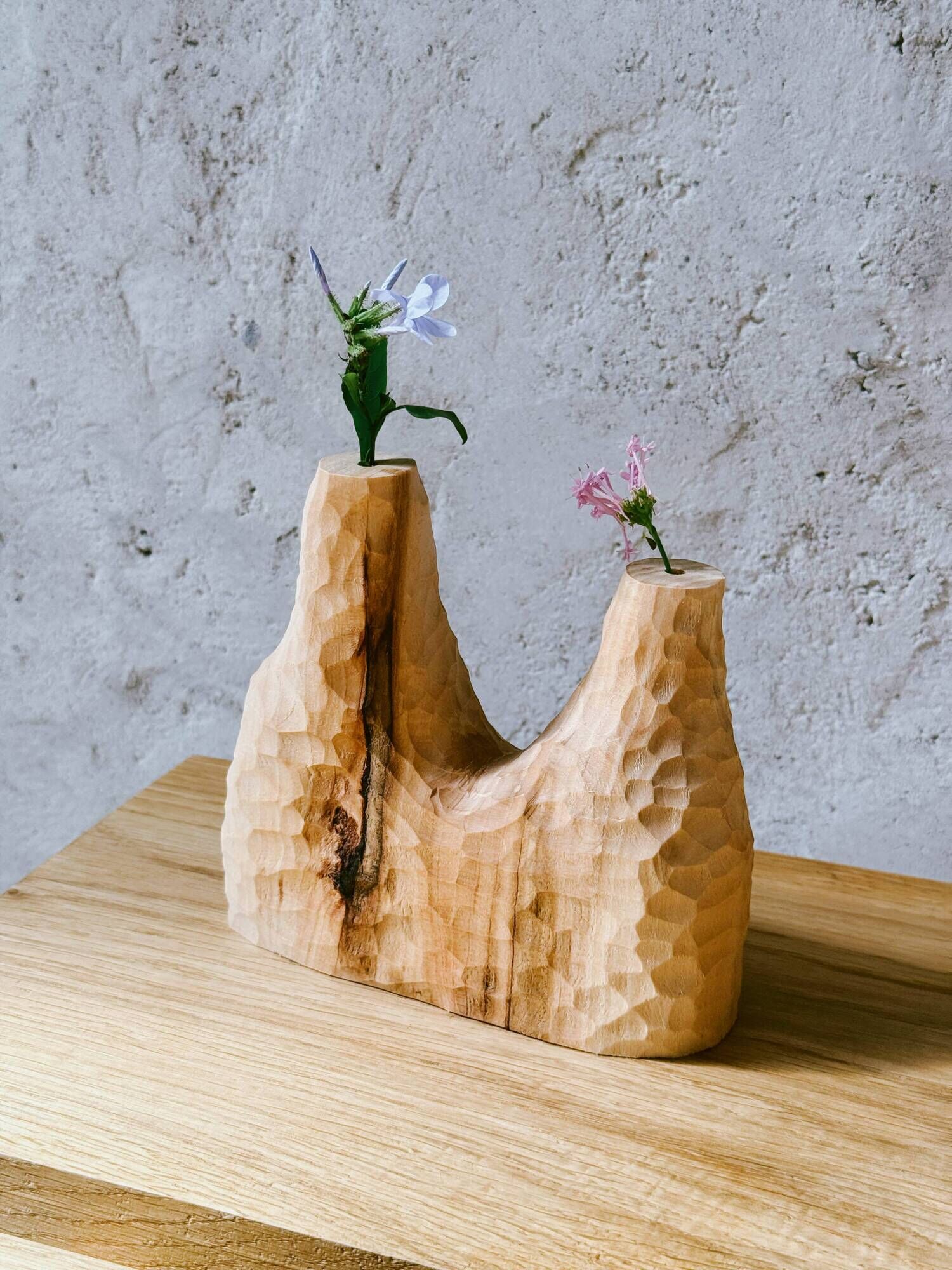 Hand-carved soliflore vase in solid lime wood.