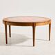 Coffee table in walnut with a ceramic top.