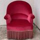 Old raspberry velvet toad armchair