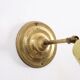 Wall lamp inlaiton and pale yellow lacquered metal