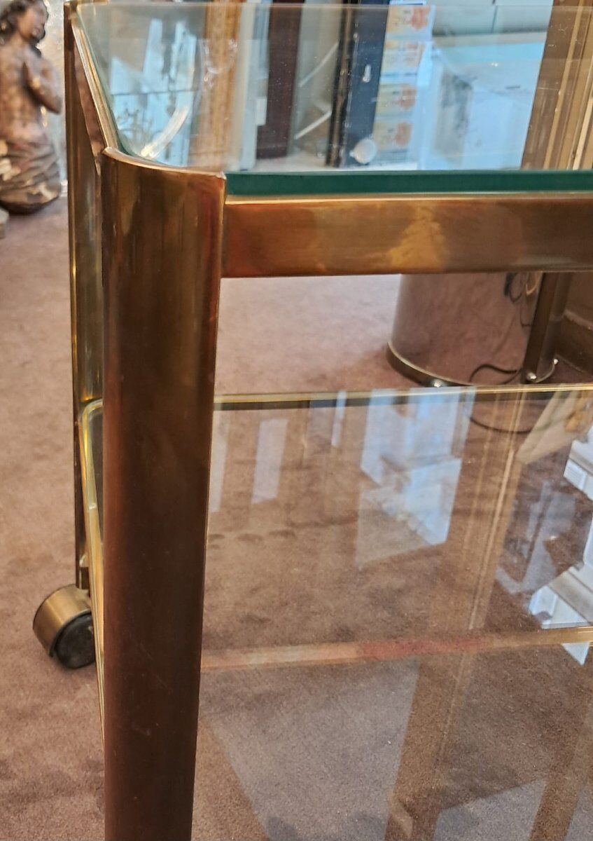 Jacques Quinet for Broncz, wheeled cart in bronze and glass, 20th century.