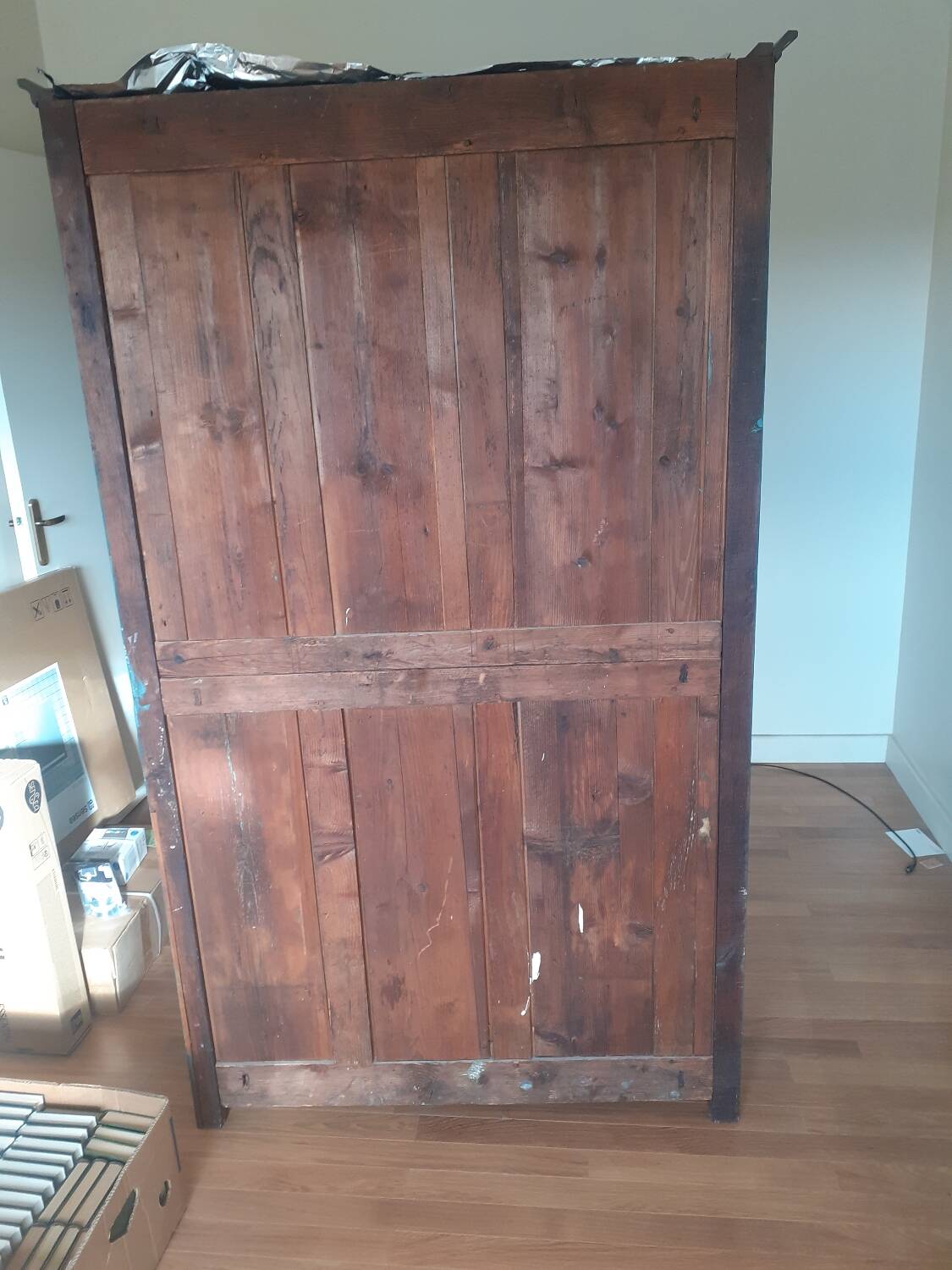 Glass-fronted cabinet in weathered green wood