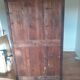 Glass-fronted cabinet in weathered green wood