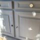 Robust country sideboard with country charm with marble handles in gray and white chalk