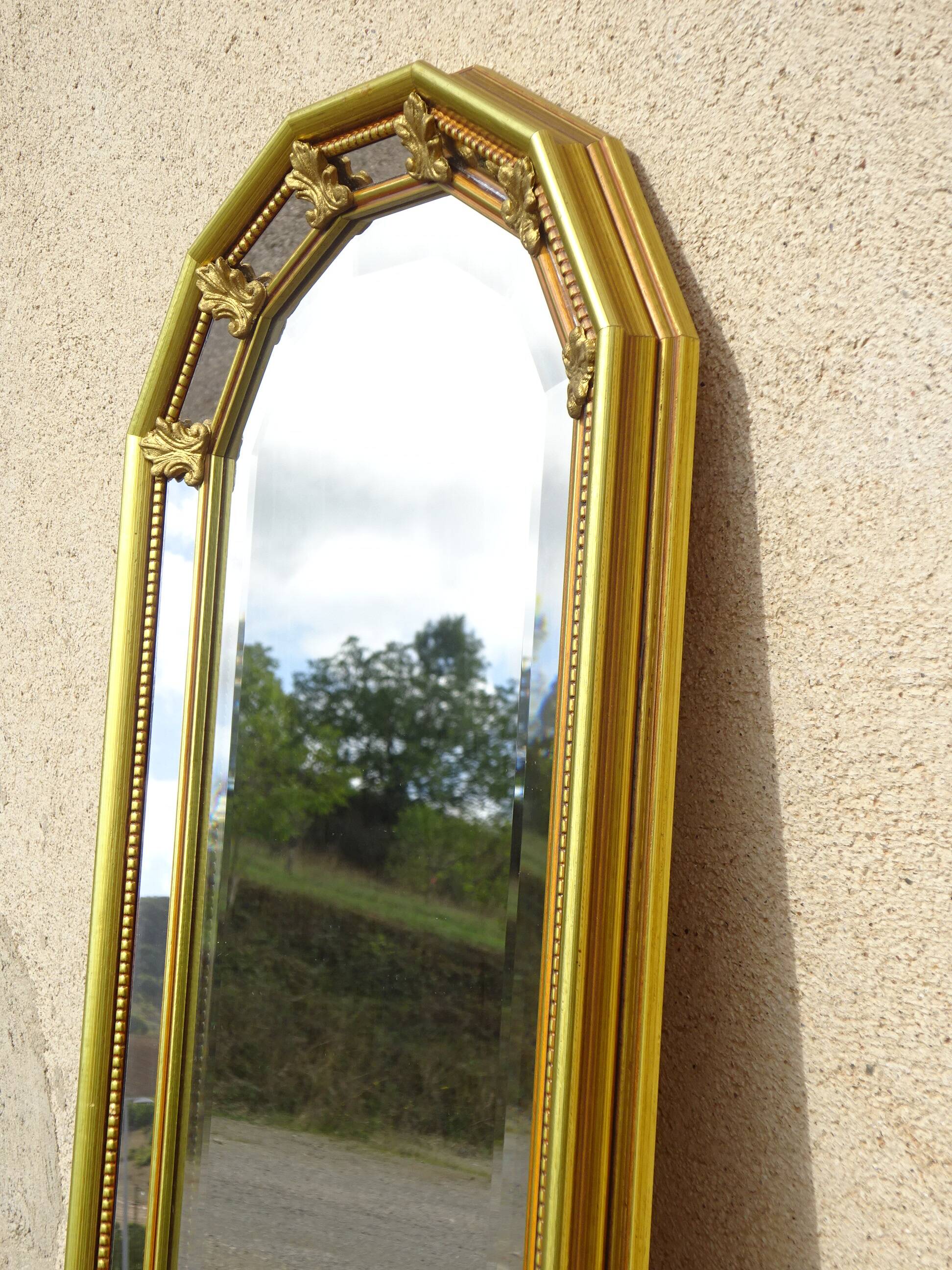 Vertical mirror, gold frame with beading.