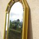 Vertical mirror, gold frame with beading.