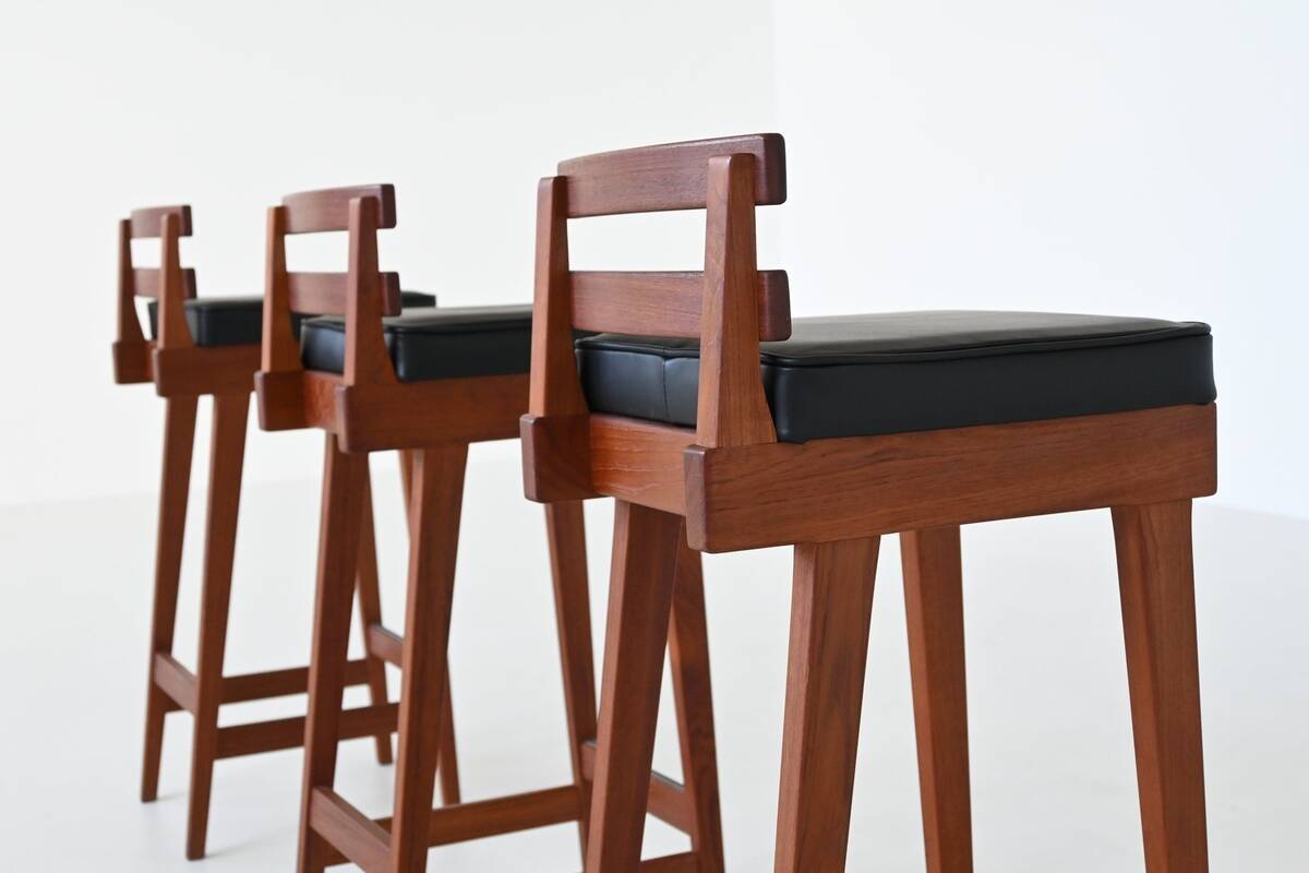Erik Buck set of three bar stools in teak and leather Dyrlund Denmark 1960