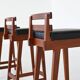 Erik Buck set of three bar stools in teak and leather Dyrlund Denmark 1960