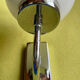 Pair of chrome metal wall lights with white glass globe.