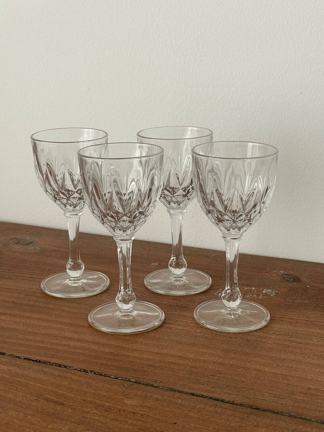 4 cut glass liqueur glasses on stems