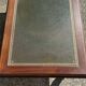 Vintage English coffee table in oak and green leather – 1950s/60s