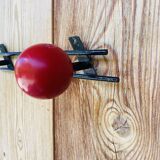 Vintage wall coat rack with 2 red and green wooden hooks
