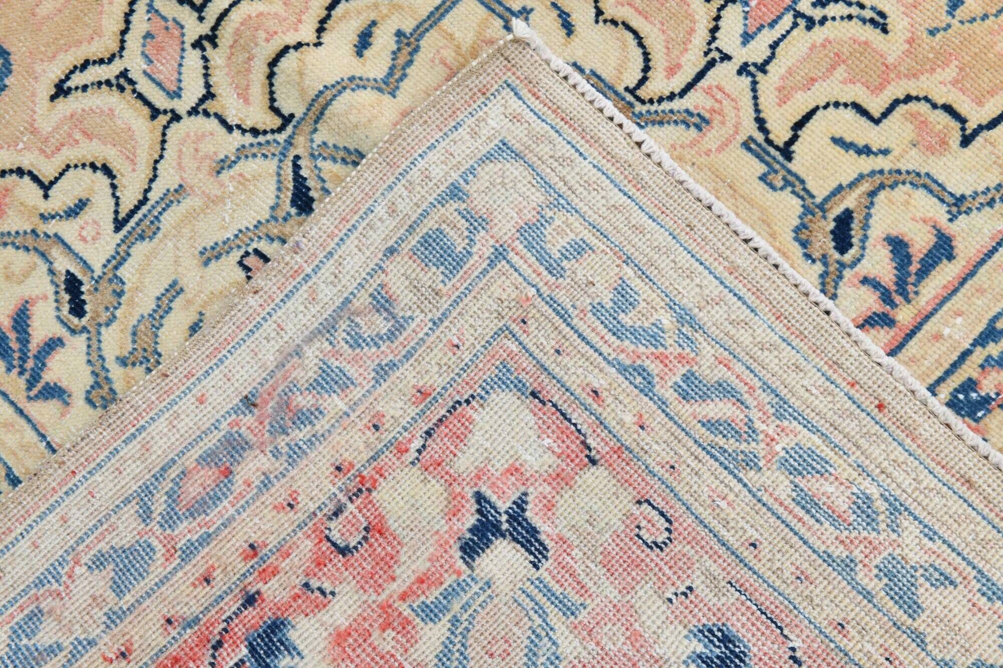 Antique Turkish wool rug in faded floral patterns, 10 x 13 feet.