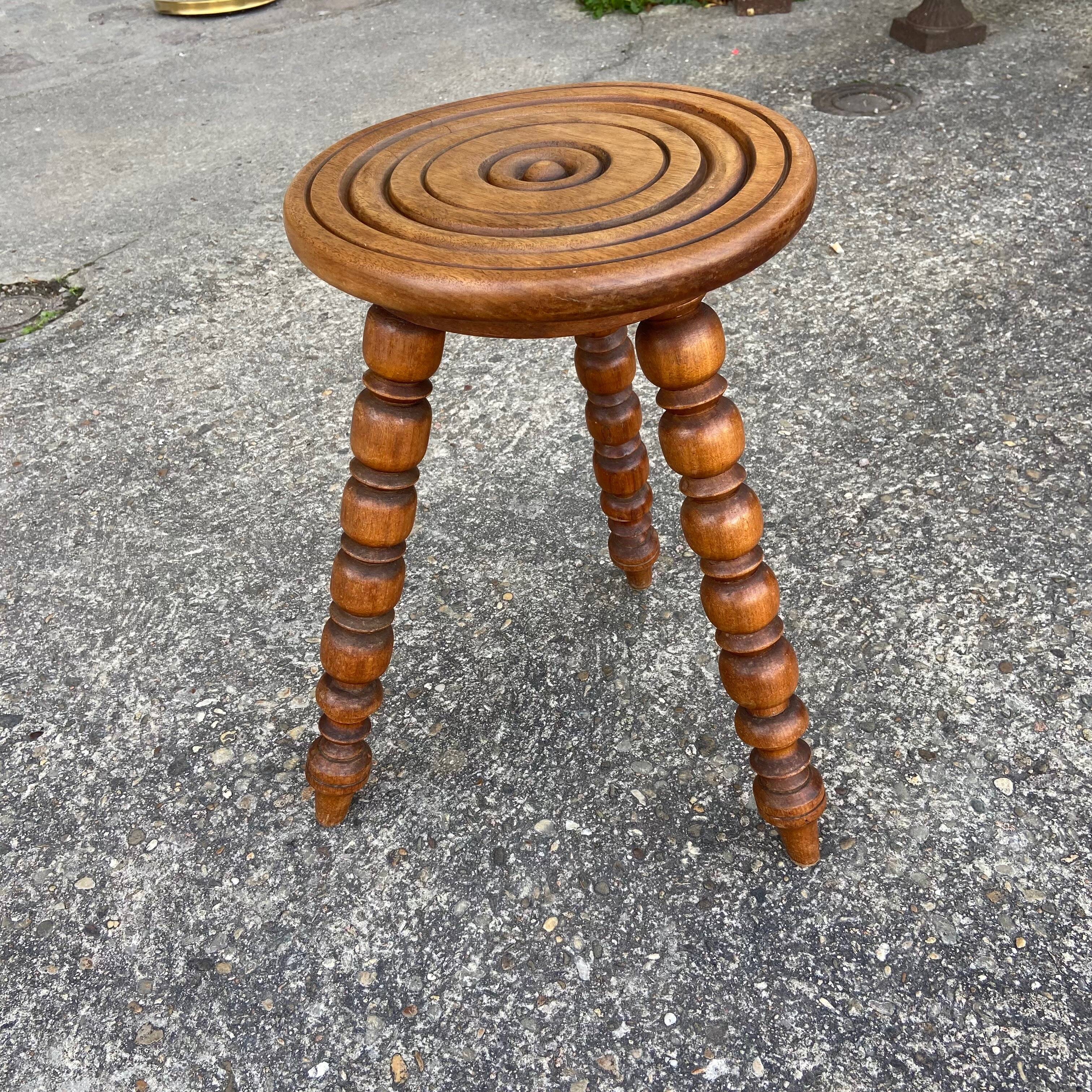 Turned wooden tripod stool