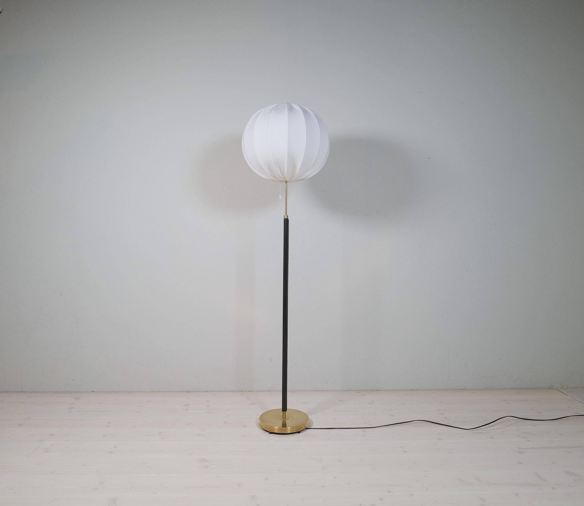 Mid-century black leather and brass floor lamp by Falkenbergs Belysning, Sweden, 1960s.