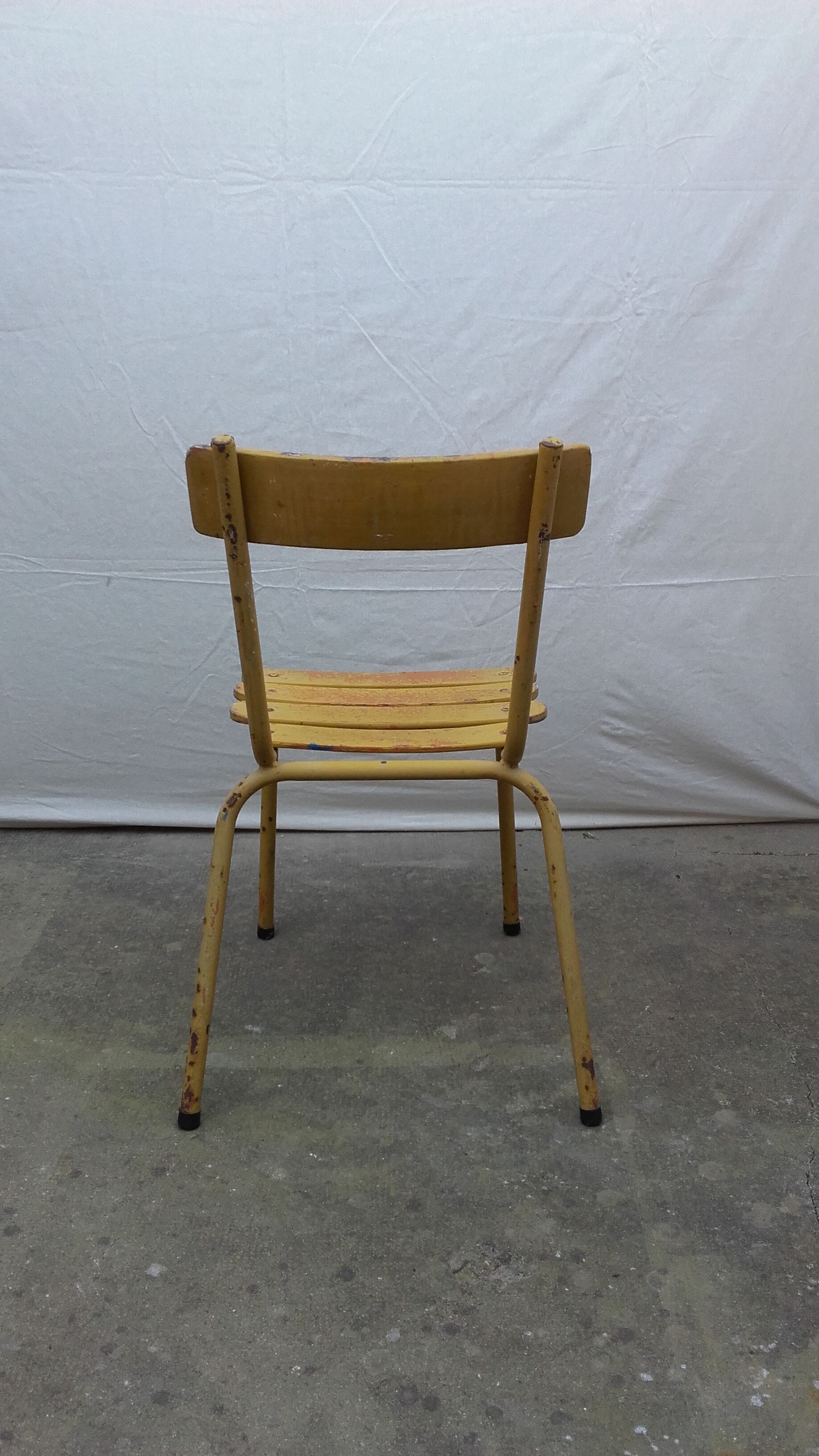 Three wooden and metal bistro chairs